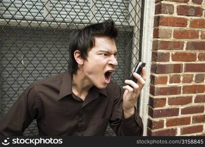 Man yelling at a phone