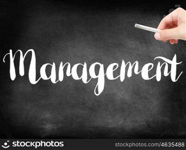 Management written on a blackboard