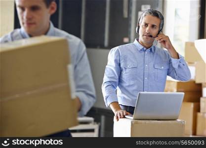 Manager Using Headset In Distribution Warehouse