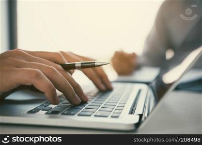 Managers are using fingers to typing personal information of employees who apply for jobs on the computer.