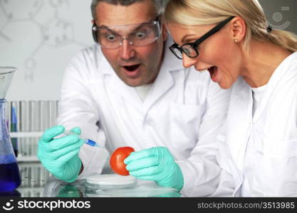 manand woman try to change tomato DNA