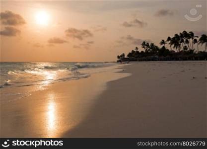 Manchebo beach on Aruba island at sunset in the Caribbean