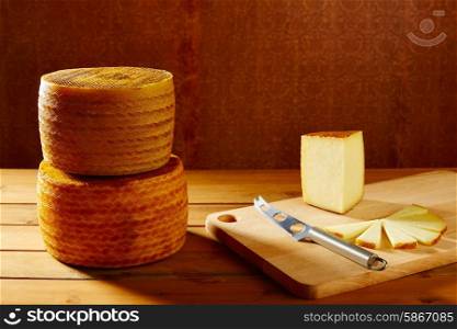 Manchego cheese from Spain in wooden table stacked
