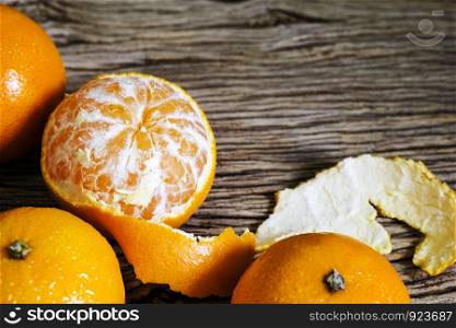Mandarin orange on wood background with copy space