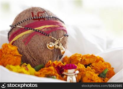 Mangalsutra tied to coconut for pooja