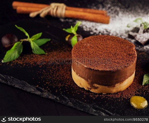 Mango and chocolate mousse on wooden black