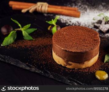 Mango and chocolate mousse on wooden black