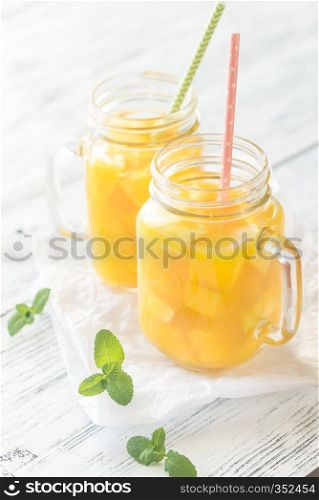 Mango juice in mason jars