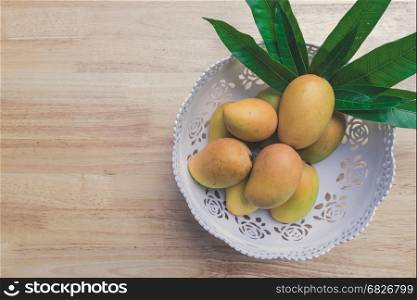 Mango on a wooden table