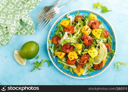 Mango shrimps salad with red pepper and lime juice. Seafood. Top view. Flat lay