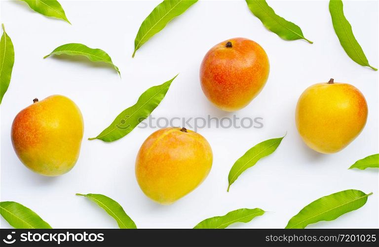Mango, Tropical fruit with leaves on white background. Top view
