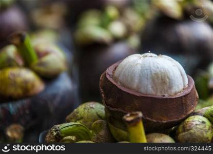 Mangosteen fruit, thick purple skin and white flesh of Queen Fruit, mangosteen fruit, delicious and healthy.