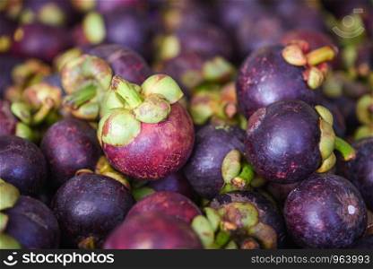 Mangosteen tropical fruit on texture background for sale in the fruit market