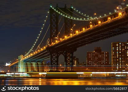 Manhattan Bridge and skyline view from Brooklyn in New York City at night