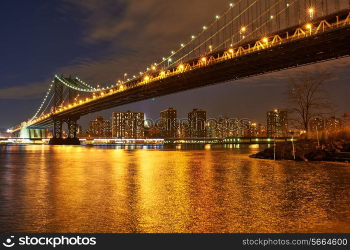 Manhattan Bridge and skyline view from Brooklyn in New York City at night