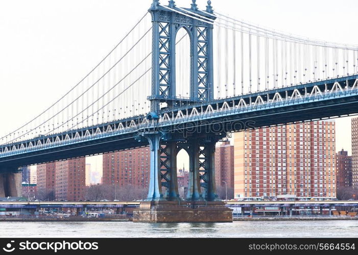 Manhattan Bridge and skyline view from Brooklyn in New York City at sunset