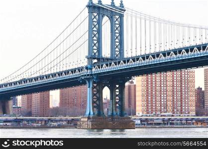 Manhattan Bridge and skyline view from Brooklyn in New York City at sunset