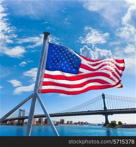 Manhattan Bridge with American flag from Brooklyn New York city US