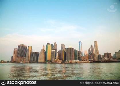 Manhattan cityscape with the Brooklyn bridge in the evening