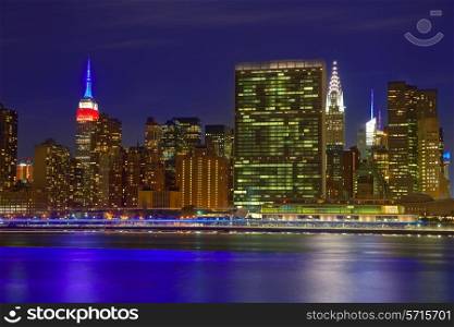 Manhattan New York skyline at sunset dusk from East River NYC USA
