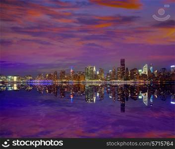 Manhattan New York skyline at sunset dusk from East River NYC USA