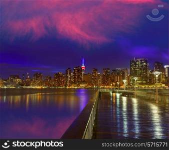 Manhattan New York skyline at sunset rainy dusk from East River NYC USA