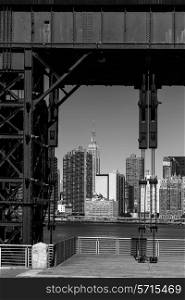 Manhattan New York skyline BW from East River floodgates structure USA