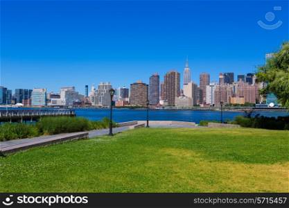 Manhattan New York sunny skyline East River NYC garden park turf USA