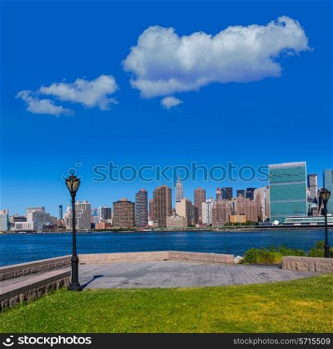 Manhattan New York sunny skyline East River NYC garden park turf USA