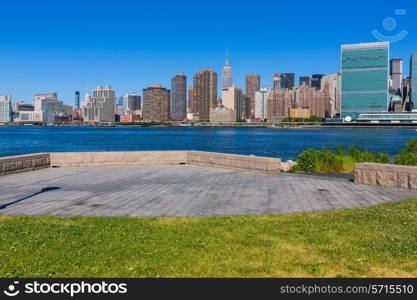 Manhattan New York sunny skyline East River NYC garden park turf USA