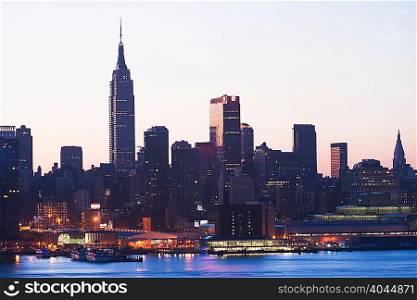 Manhattan skyline and waterfront at dusk, New York City, USA