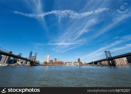 Manhattan skyline view from Brooklyn between Brooklyn Bridge and Manhattan Bridge in New York City