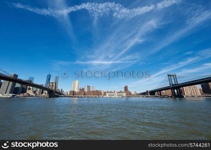 Manhattan skyline view from Brooklyn between Brooklyn Bridge and Manhattan Bridge in New York City