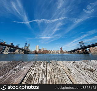 Manhattan skyline view from Brooklyn between Brooklyn Bridge and Manhattan Bridge in New York City