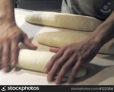 Manrolling out bread