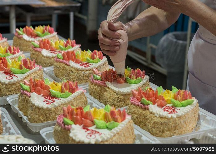 Manual cakes production. Manual cakes production on factory