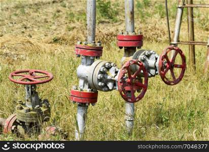 Manual shut-off valve on oil well. Oil well wellhead equipment. Manual shut-off valve on oil well. Oil well wellhead equipment.