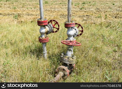 Manual shut-off valve on oil well. Oil well wellhead equipment. Manual shut-off valve on oil well. Oil well wellhead equipment.