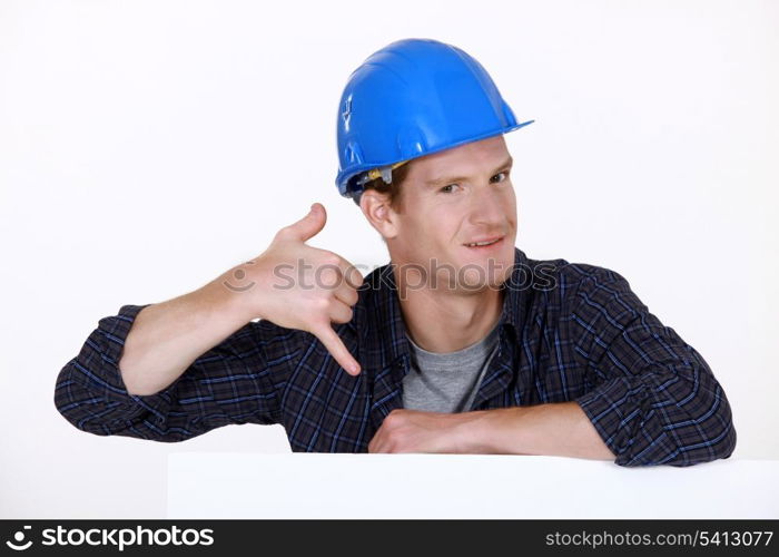 Manual worker making a phone shape