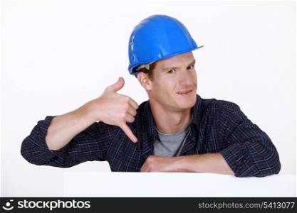 Manual worker making a phone shape