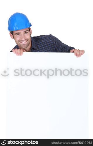 Manual worker stood with advertisement board