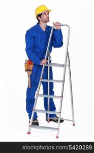 Manual worker stood with step-ladder