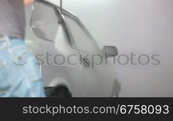 Manual Worker wash car with water pressure
