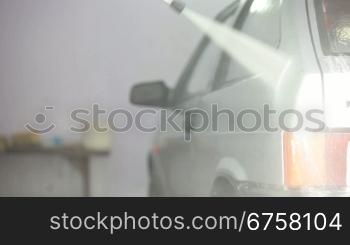 Manual Worker wash car with water pressure