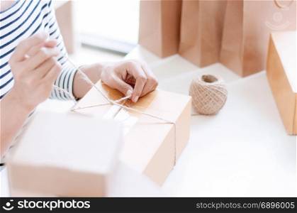 Manual worker working / packaging with boxes in store