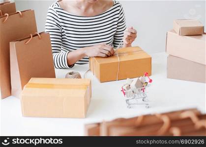 Manual worker working / packaging with boxes in store, shopping online and e-commerce concept