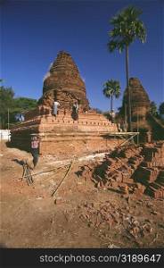 Manual workers repairing a pagoda, Bagan, Myanmar