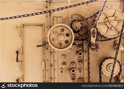 manufacture and industry concept - vintage machine mechanism at old abandoned factory. vintage machine mechanism at old abandoned factory
