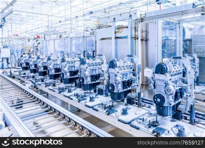 manufacturing of car engine at car plant. car engines at conveyor line
