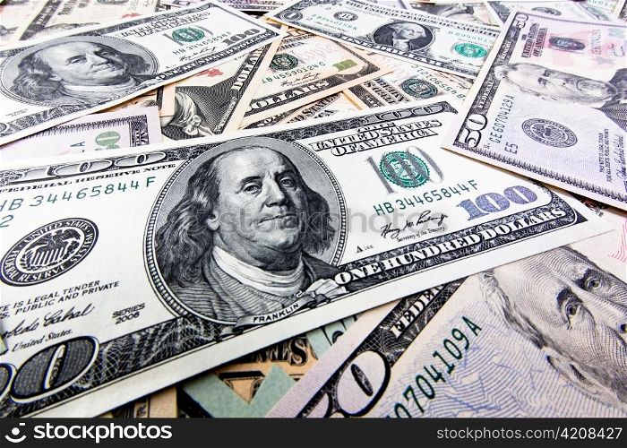 many american dollar bills lying side by side. currency of the united states